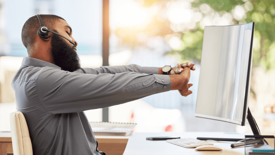 man stretching in an ergonomic chair