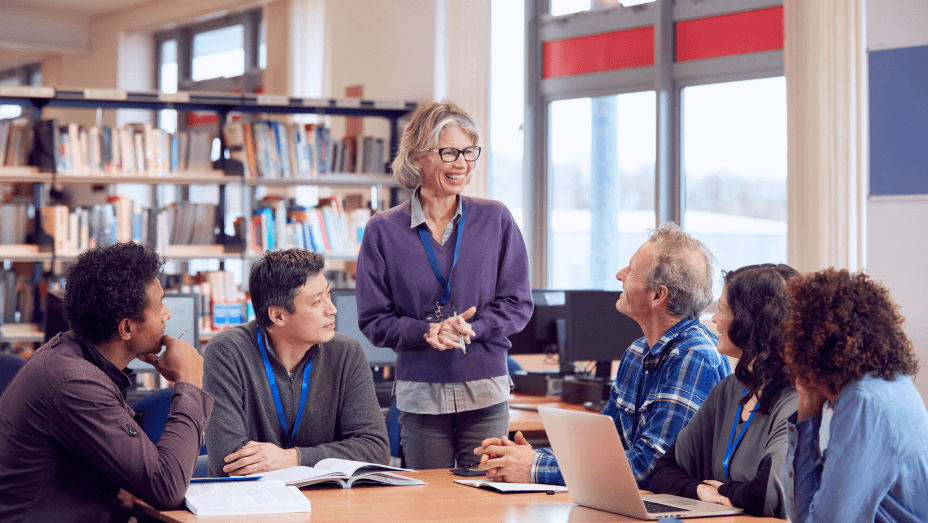 teacher-with-group-of-mature-adult-students-in-class